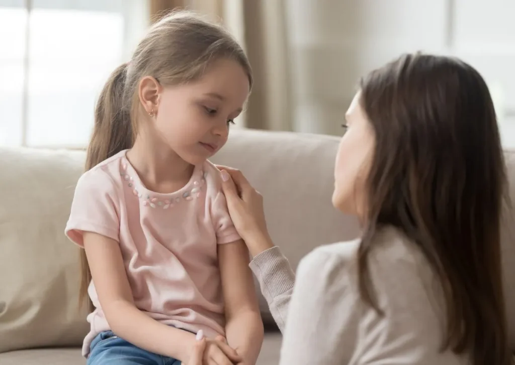 a mother explains to her daughter the procedures to expect at the annual well-child exams